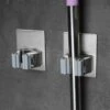 Merkloos Mop Houder - Mop - Houder - Bezem Ophangsysteem - Bezem Houder - Hanger - Staal 1 Merkloos Mop Houder - Mop - Houder - Bezem Ophangsysteem - Bezem Houder - Hanger - Staal -Tuinverzorgings Winkel 1200x1200 489
